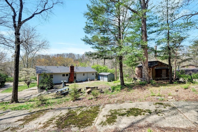 exterior space with an outbuilding and a storage unit