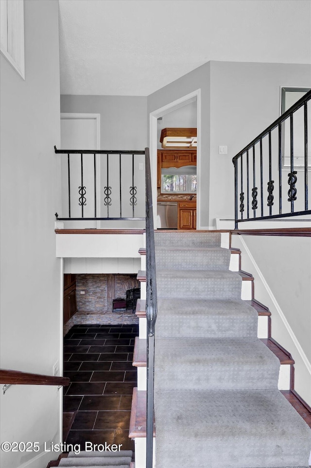 stairway with wood finished floors