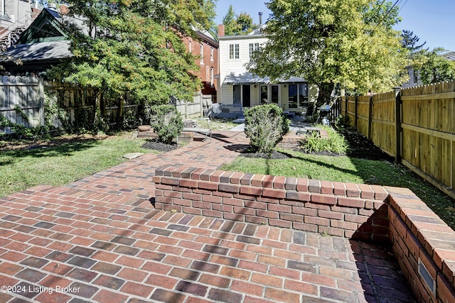 view of yard with a patio area and a fenced backyard