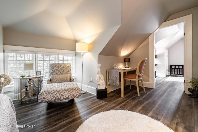 bedroom with baseboards, wood finished floors, and lofted ceiling