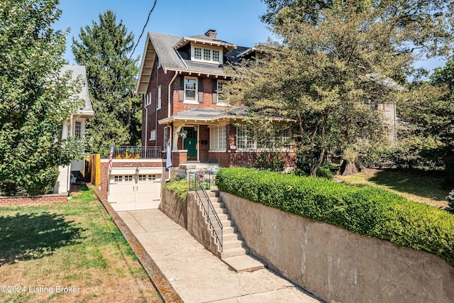 view of front of property with a front yard, a garage, a chimney, brick siding, and driveway