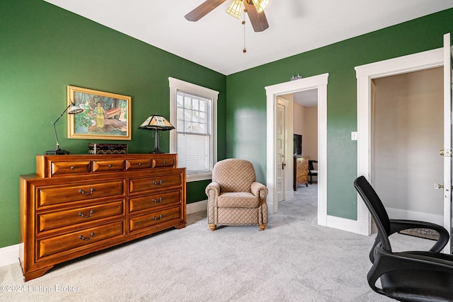 office area featuring carpet floors, baseboards, and ceiling fan
