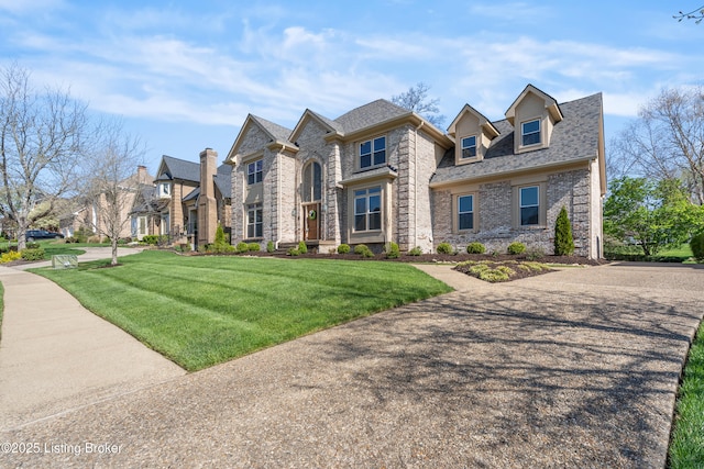 14801 Forest Oaks Dr, Louisville, KY 40245 - french provincial home featuring a shingled roof, a front yard, and brick siding