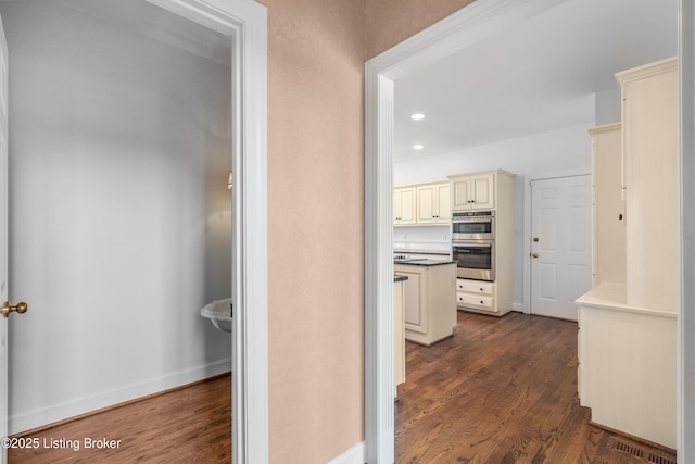 14801 Forest Oaks Dr, Louisville, KY 40245 - hallway with dark wood-type flooring, visible vents, baseboards, and recessed lighting