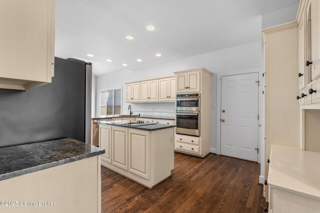 14801 Forest Oaks Dr, Louisville, KY 40245 - kitchen featuring a sink, cream cabinetry, recessed lighting, stainless steel appliances, and dark wood-type flooring