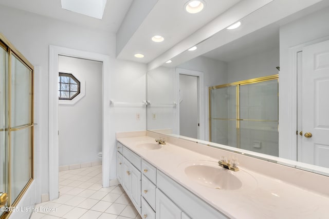 14801 Forest Oaks Dr, Louisville, KY 40245 - bathroom featuring double vanity, tile patterned floors, toilet, a shower with shower door, and a sink