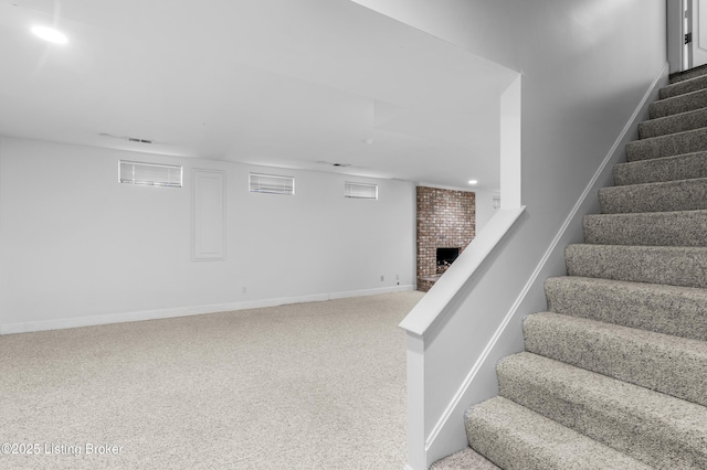 14801 Forest Oaks Dr, Louisville, KY 40245 - stairs with visible vents, recessed lighting, carpet flooring, a brick fireplace, and baseboards