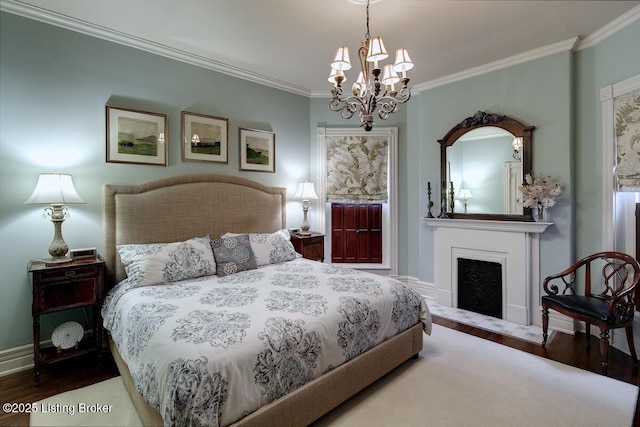 bedroom featuring a chandelier, crown molding, wood finished floors, and a fireplace with flush hearth