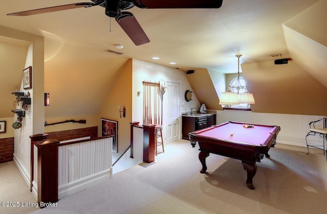 recreation room with visible vents, light colored carpet, a ceiling fan, and lofted ceiling