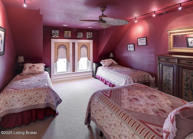 bedroom with visible vents, track lighting, and carpet floors