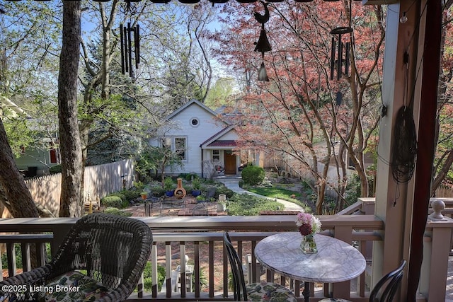 view of front of home featuring fence