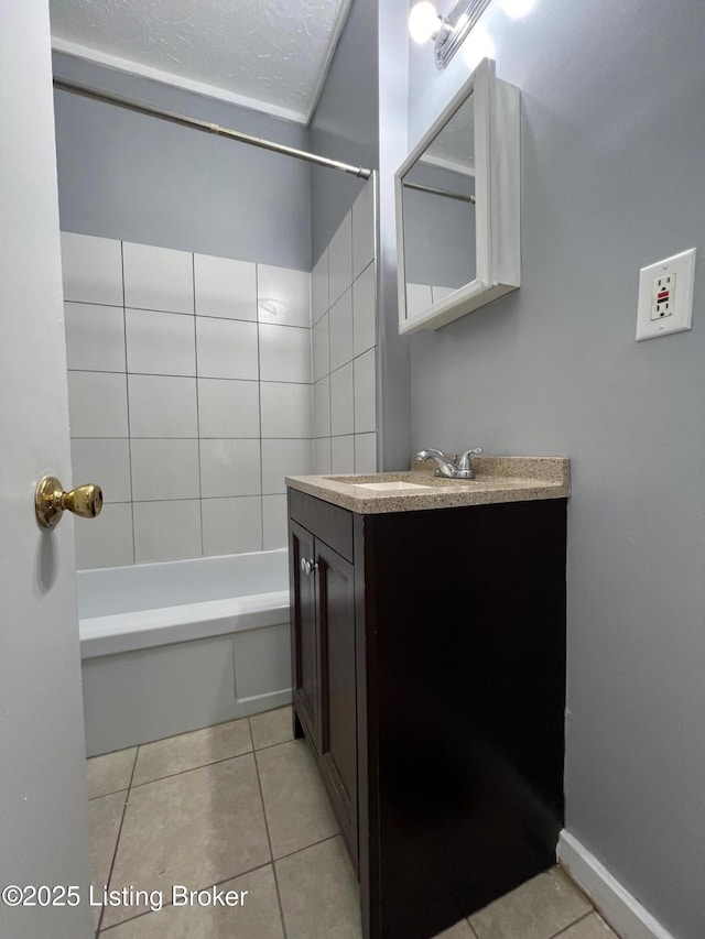 bathroom with vanity, tile patterned flooring, and  shower combination