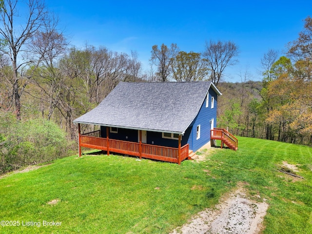 7700 Organ Creek Rd, Pendleton, KY 40055 - view of property exterior featuring a lawn, a wooden deck, a shingled roof, and a wooded view