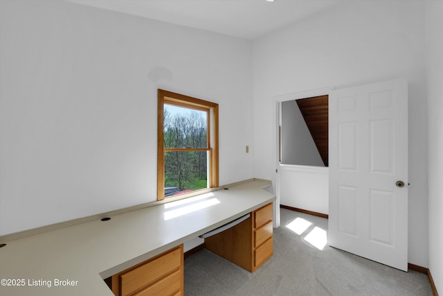7700 Organ Creek Rd, Pendleton, KY 40055 - unfurnished office featuring built in desk, lofted ceiling, light colored carpet, and baseboards
