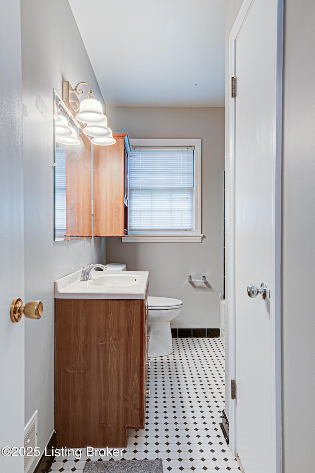 3014 Nadina Dr, Louisville, KY 40220 - bathroom featuring tile patterned flooring, toilet, vanity, and baseboards