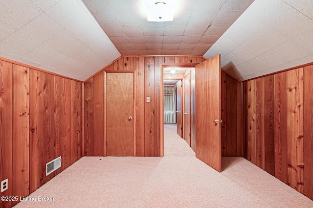 3014 Nadina Dr, Louisville, KY 40220 - additional living space featuring visible vents, wood walls, carpet, and lofted ceiling