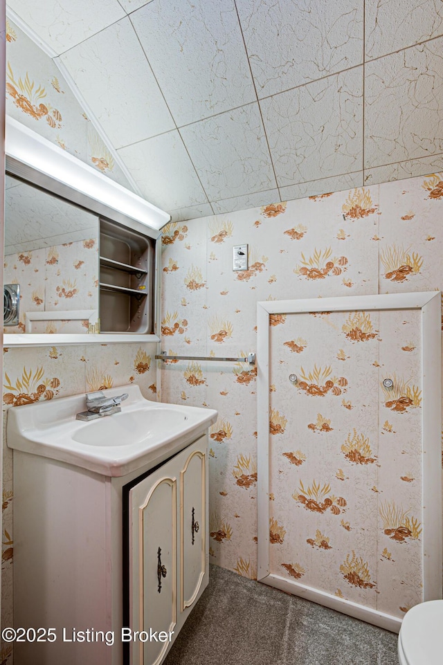 3014 Nadina Dr, Louisville, KY 40220 - half bath featuring toilet, wallpapered walls, and vanity