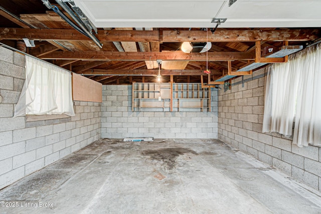 3014 Nadina Dr, Louisville, KY 40220 - garage with a garage door opener and concrete block wall