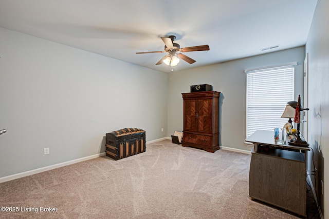 sitting room featuring baseboards, a ceiling fan, visible vents, and carpet floors