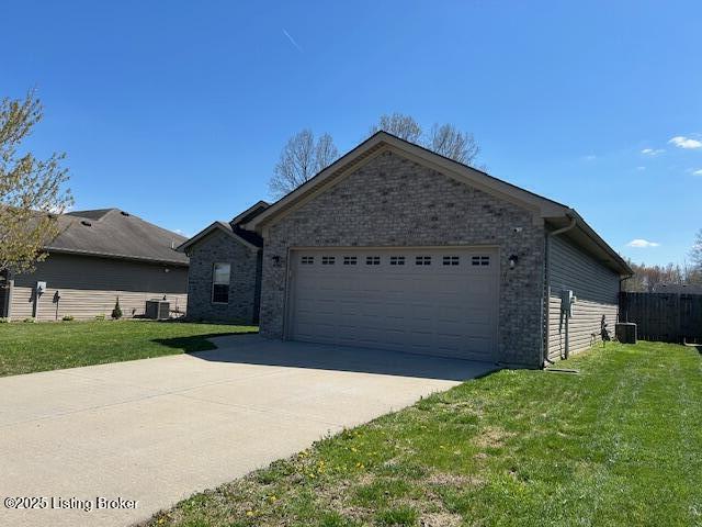 view of front facade featuring central AC unit, a garage, driveway, and a front lawn