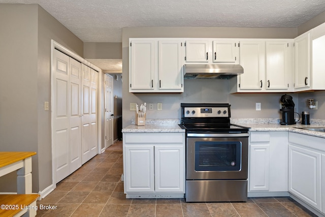kitchen featuring stainless steel range with electric stovetop, a textured ceiling, under cabinet range hood, white cabinetry, and light stone counters