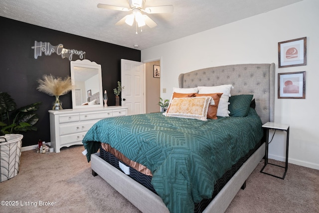 carpeted bedroom featuring baseboards and a ceiling fan