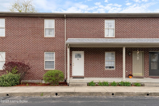 view of property with brick siding