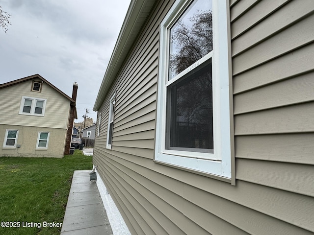 view of home's exterior with a lawn
