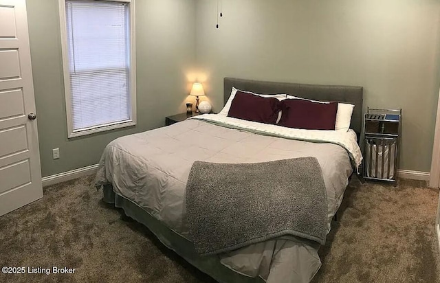carpeted bedroom featuring baseboards