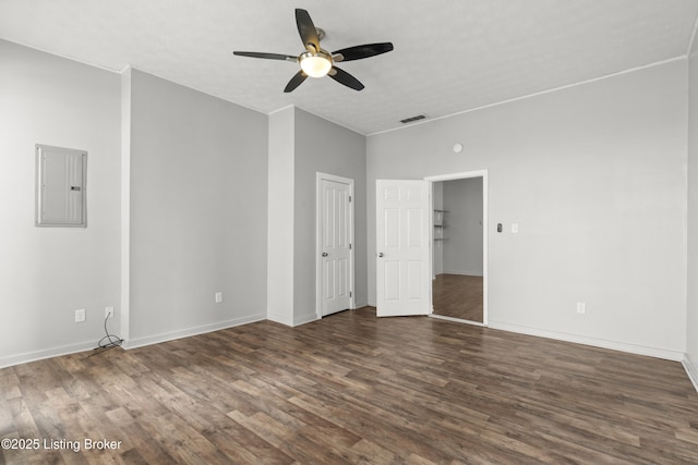 unfurnished bedroom featuring visible vents, baseboards, electric panel, ceiling fan, and dark wood finished floors