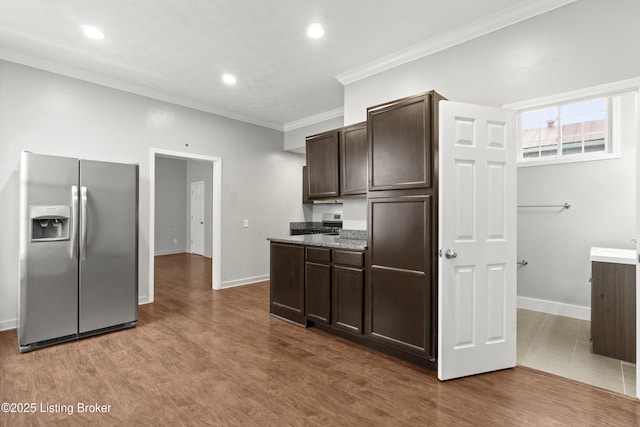 kitchen featuring stainless steel fridge with ice dispenser, recessed lighting, dark brown cabinetry, and crown molding