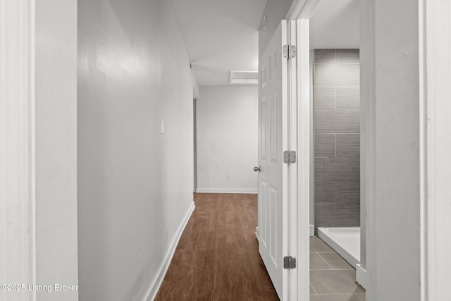 hallway featuring baseboards