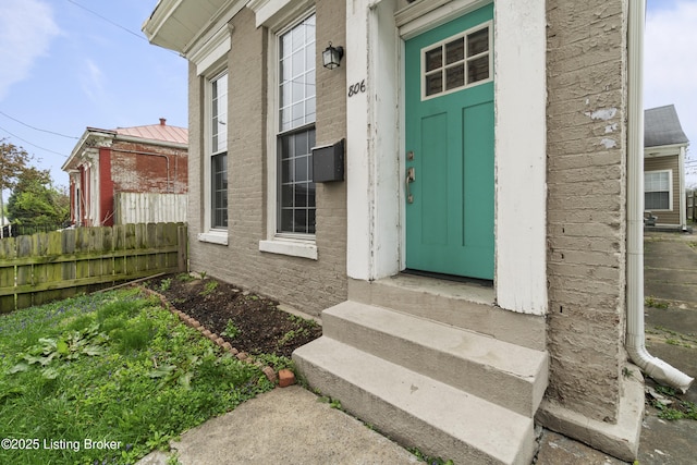 property entrance featuring fence