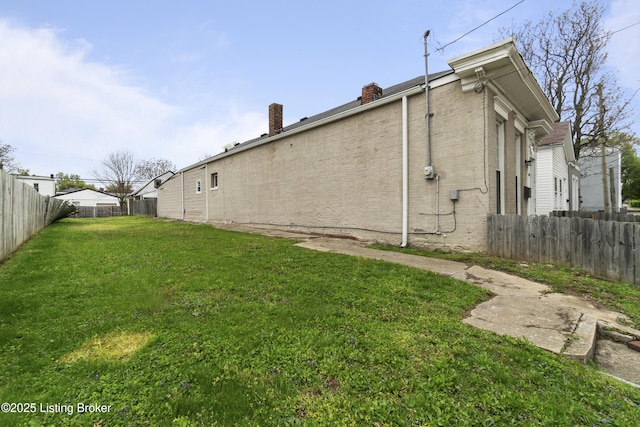 exterior space with a fenced backyard