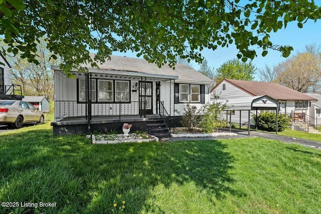 bungalow-style house featuring a carport and a front lawn