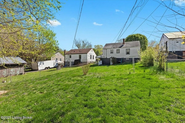 view of yard with a fenced backyard and a residential view