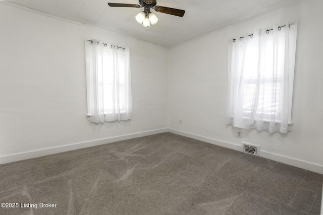 1125 W Whitney Ave, Louisville, KY 40215 - carpeted spare room with crown molding, baseboards, a ceiling fan, and visible vents