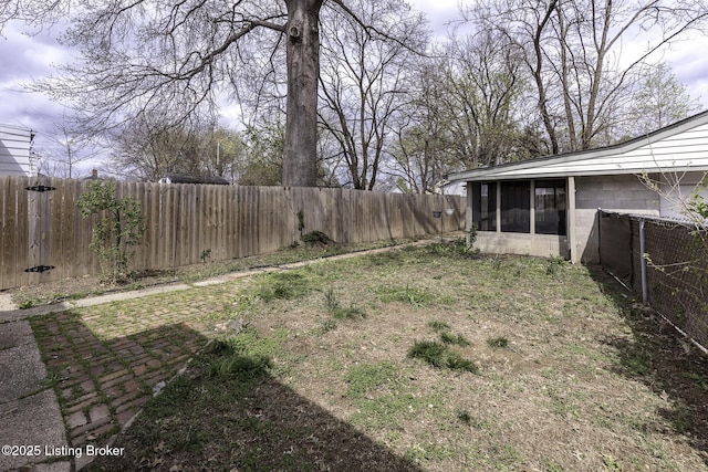 1125 W Whitney Ave, Louisville, KY 40215 - view of yard with a sunroom and a fenced backyard