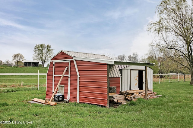 view of shed with fence