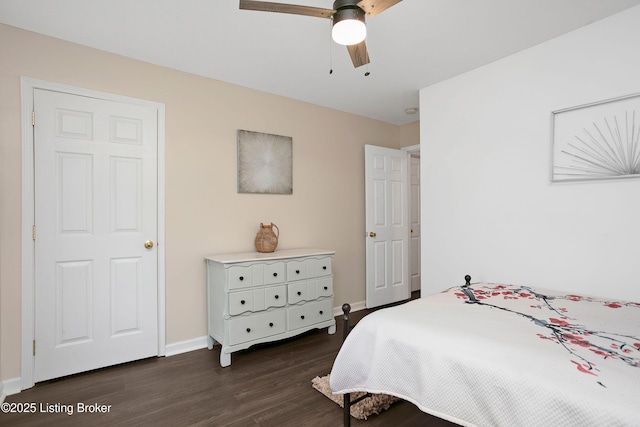 bedroom featuring dark wood-style flooring, baseboards, and ceiling fan