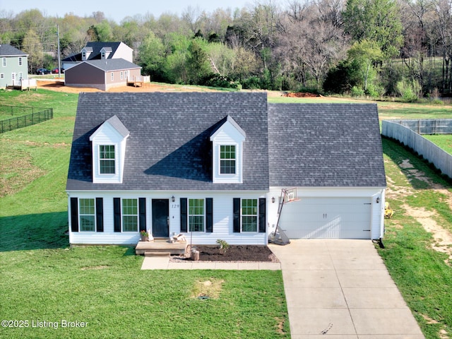 cape cod house with roof with shingles, a front yard, driveway, and a garage