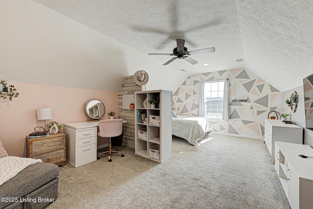 bedroom with ceiling fan, vaulted ceiling, a textured ceiling, and light colored carpet