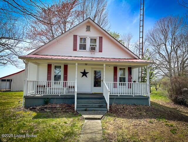 279 Pleasant View Rd, Millwood, KY 42762 - bungalow featuring a porch, cooling unit, and metal roof