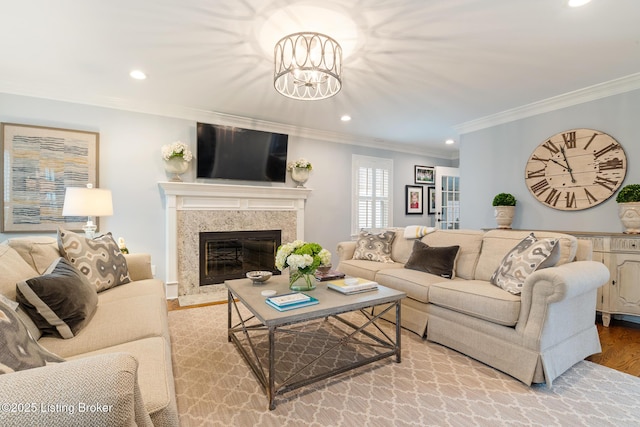 living room with light wood-style floors, a fireplace, and recessed lighting
