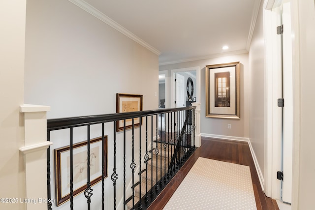hall featuring baseboards, recessed lighting, an upstairs landing, crown molding, and wood finished floors