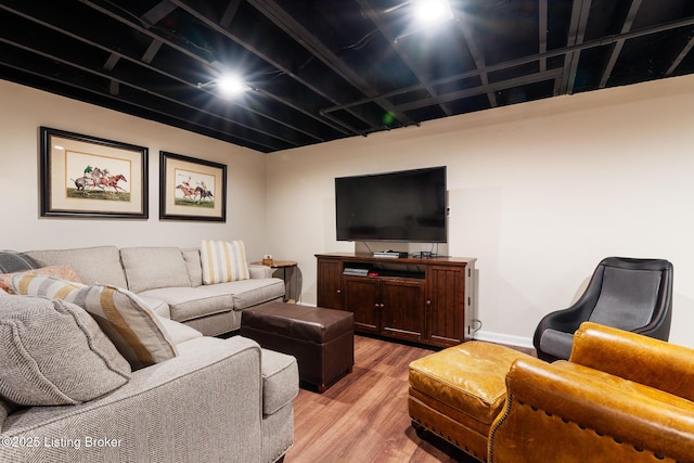 living room featuring baseboards and light wood finished floors