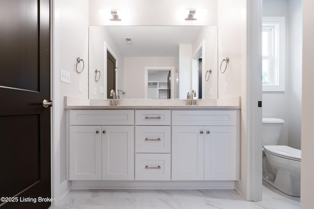 3238 Catalpa Farms Dr, Fisherville, KY 40023 - full bathroom with marble look tile flooring, double vanity, and toilet