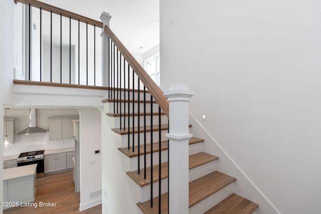 3238 Catalpa Farms Dr, Fisherville, KY 40023 - stairway with wood finished floors and arched walkways