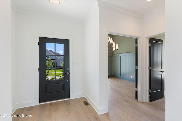 3238 Catalpa Farms Dr, Fisherville, KY 40023 - foyer entrance with light wood-style flooring, a chandelier, crown molding, and baseboards