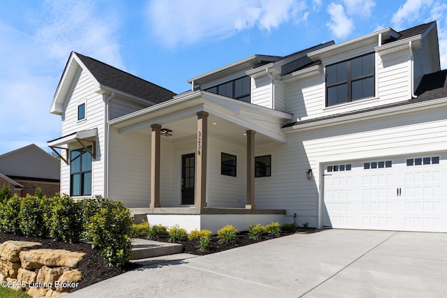 3238 Catalpa Farms Dr, Fisherville, KY 40023 - view of front of house with a porch, driveway, and a garage